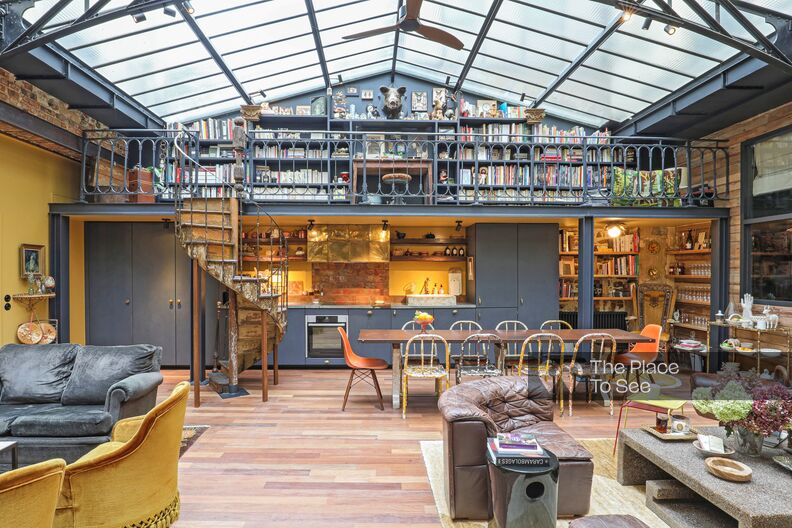 colorful and shabby chic loft with industrial glass roof