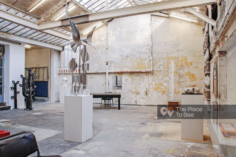 Art galery with glass-roof and faded walls 