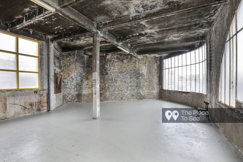 Raw and faded space with glass roof and rooftop