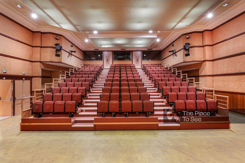 70's style auditorium, lobby, office and meeting room