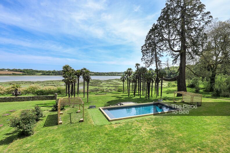 Beautiful estate pool, palm trees and sea view