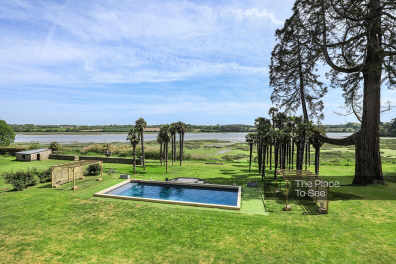Beautiful estate pool, palm trees and sea view