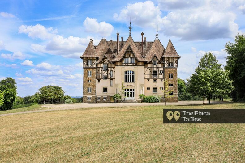 19h century castle half-timbered facades and English style park
