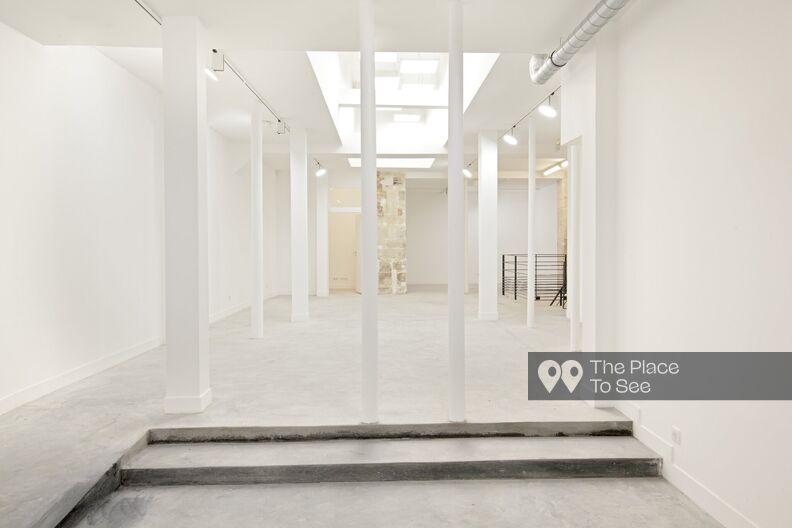 Empty Art Gallery showroom with white walls and concrete floor