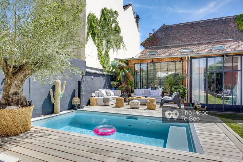 Brick house with loft outbuilding and swimming pool