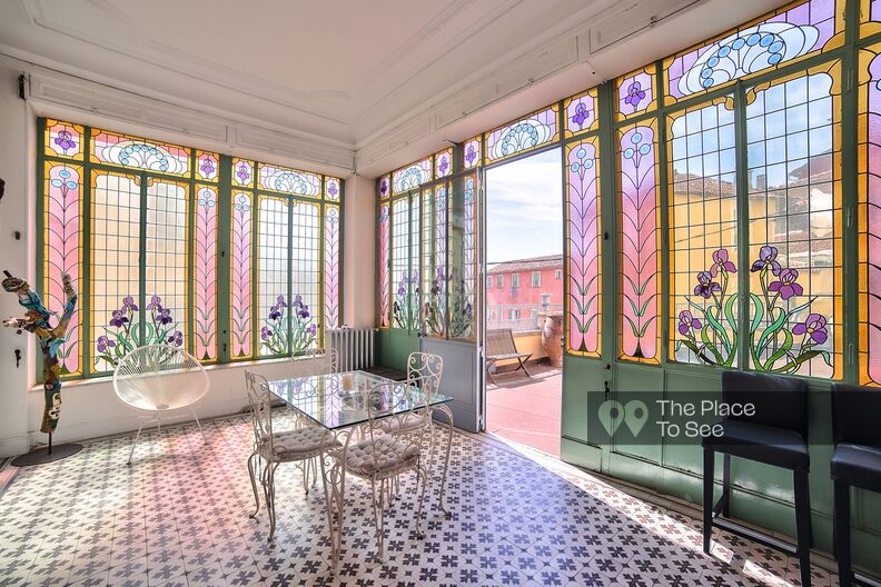 Colorful apartment in an 18th century building with moldings