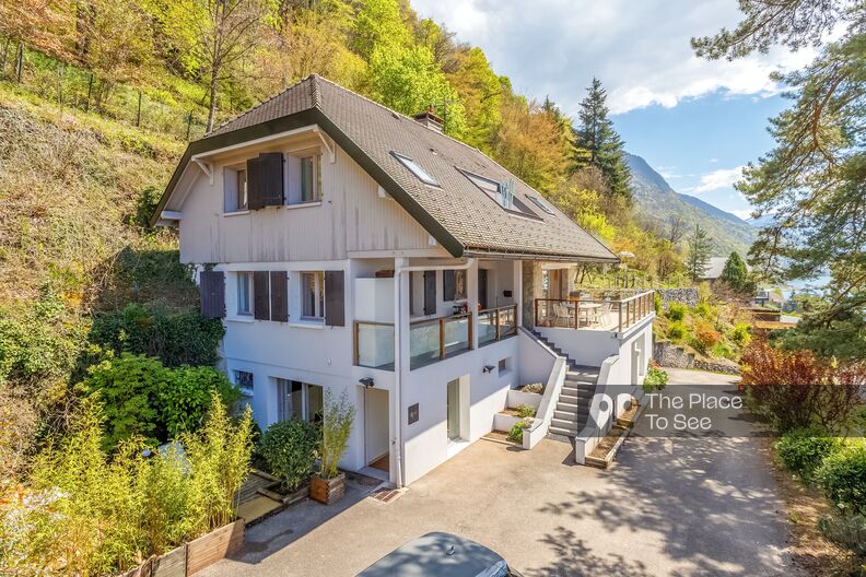 Large modern house with lake and mountain views