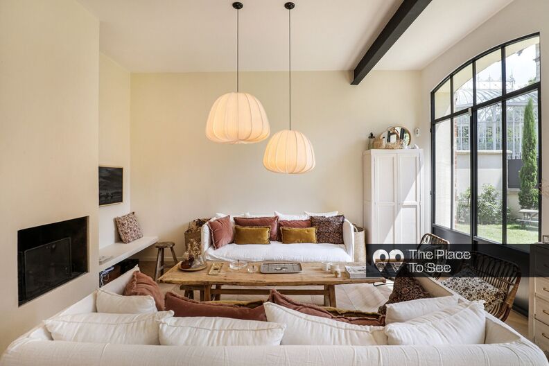 Former stables transformed into a warm and elegant house