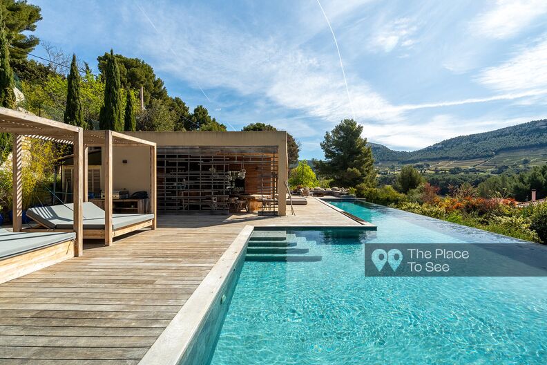 Modern bohemian chic wooden villa with infinity pool