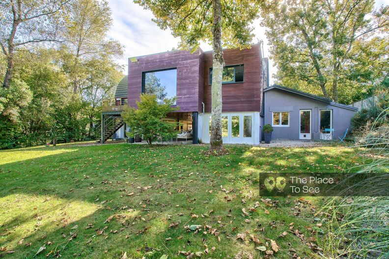 Atypical architect's house on the edge of a lake