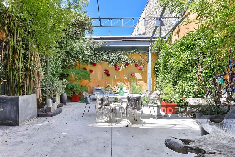 Loft with patio bathed in light