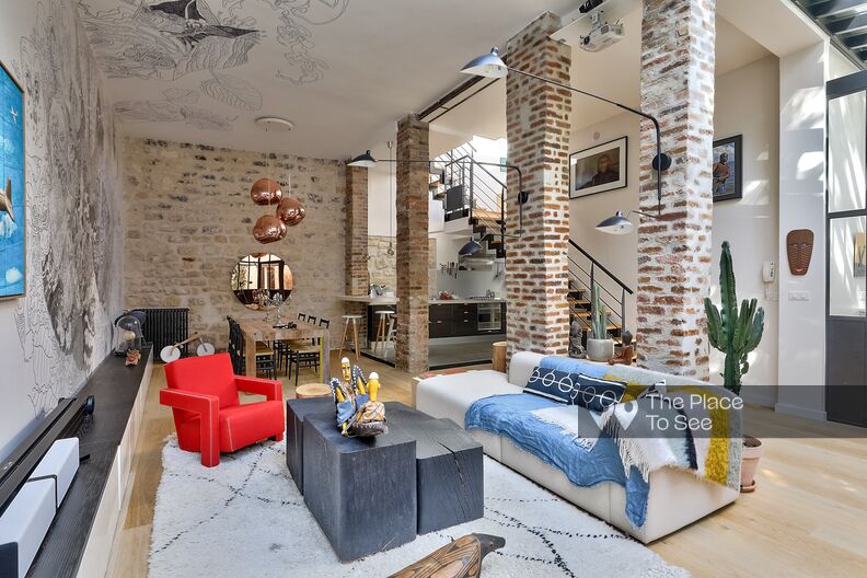 Brick and glass roof loft in duplex