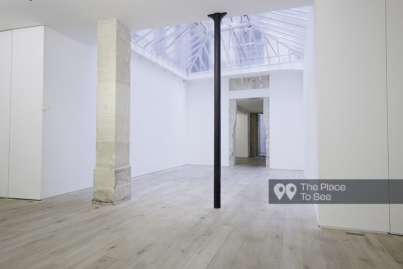 Gallery with glass roof and parquet flooring