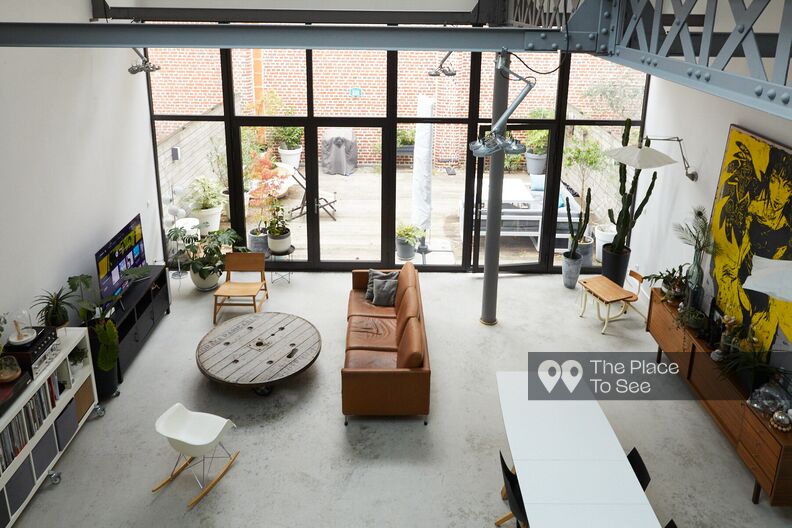 Industrial loft with bay window and concrete floor