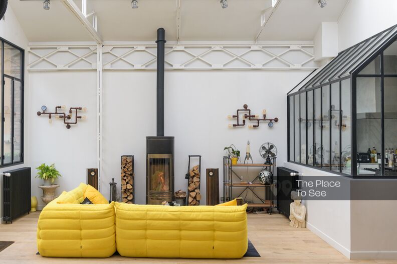 Sleek industrial loft under glass roof