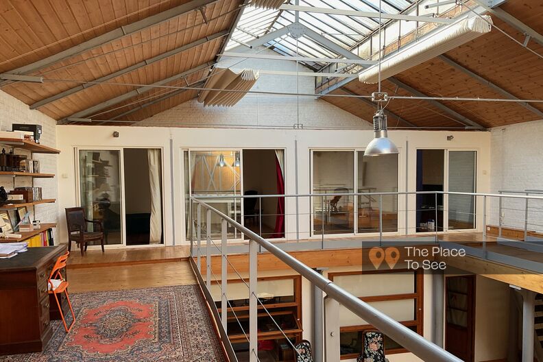 Industrial loft in raw style with wood and metal