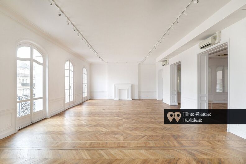 Very large empty classic Parisian apartment with white walls