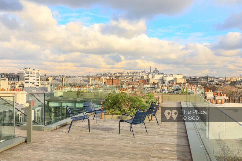 Office building with rooftop and view over all of Paris