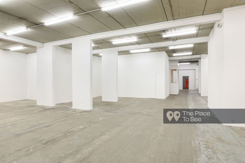Large gallery with concrete floor and white walls