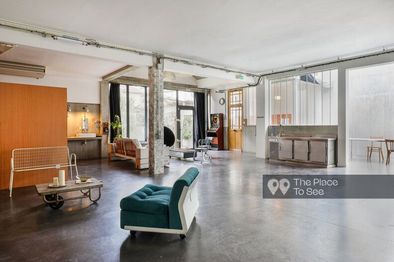 Loft-style photo studio with concrete flooring