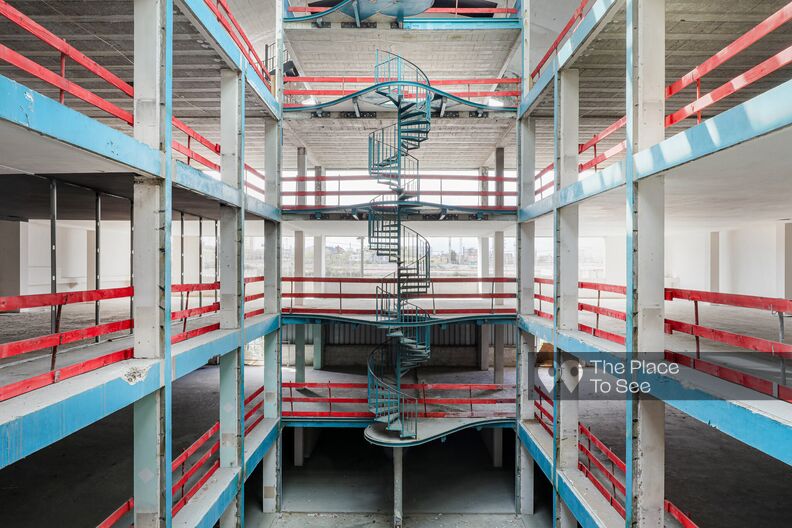 Raw concrete factory with a view of the Parisian ring road