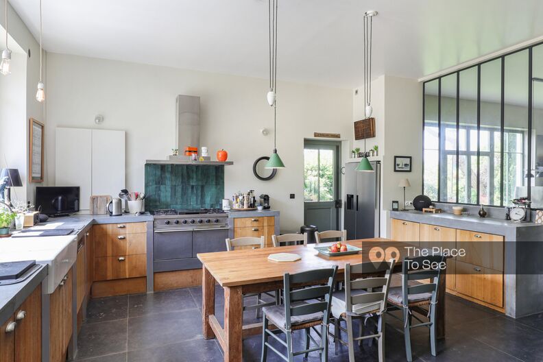 Industrial loft house with a beautiful wood and concrete kitchen