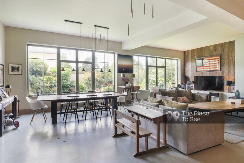 Industrial loft house with a beautiful wood and concrete kitchen