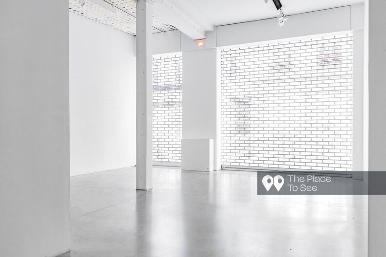 Empty showroom gallery, white walls and concrete floor