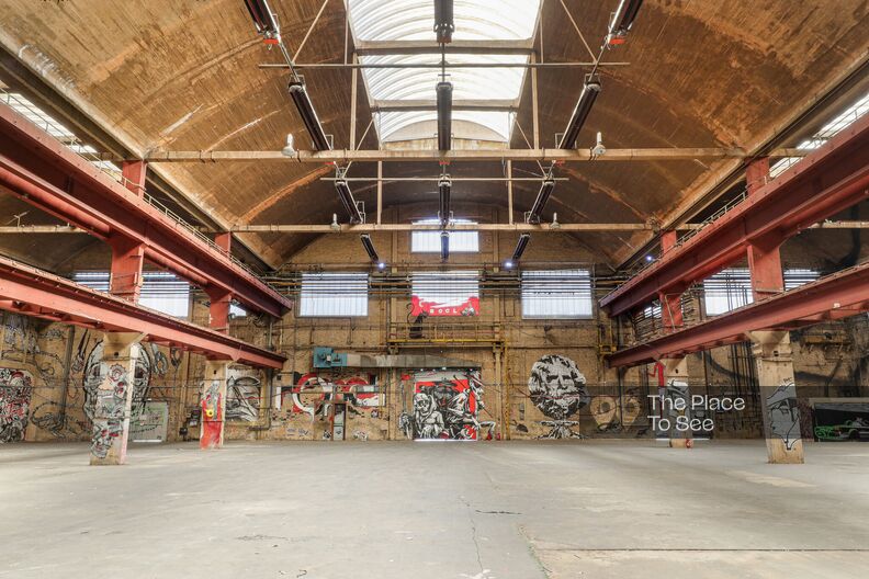 Large, patinated shed with graffiti
