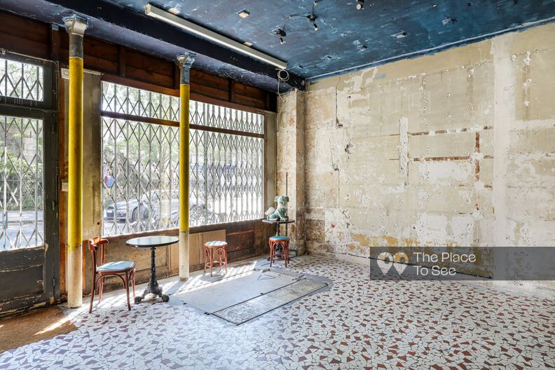 Former shop transformed into a Art Gallery with faded walls