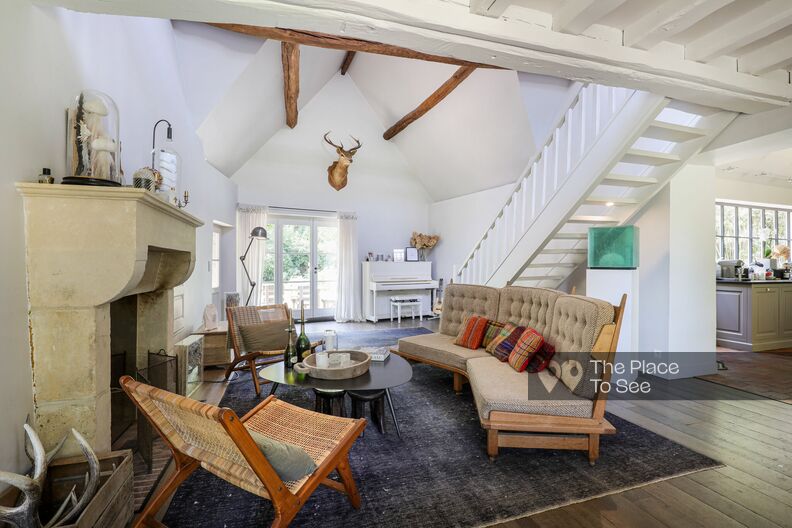 Stone and beam farmhouse with a chic country feel