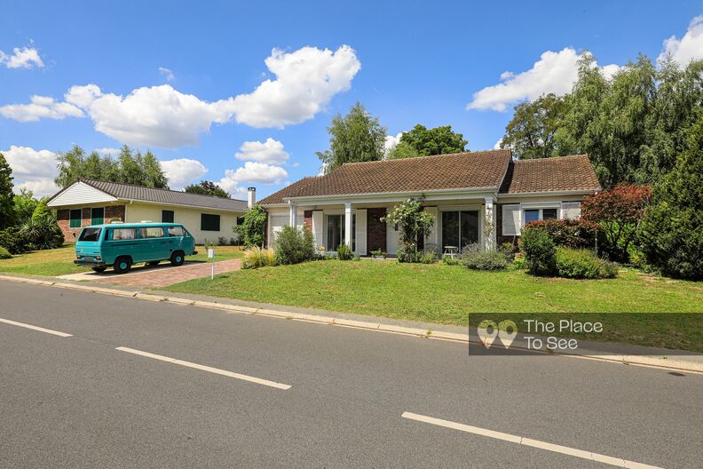 Single-story American-style house with vintage Volkswagen van