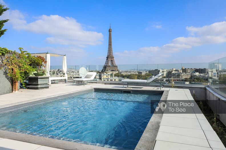 Spectacular rooftop terrace featuring a pool and panoramic views of the Eiffel Tower