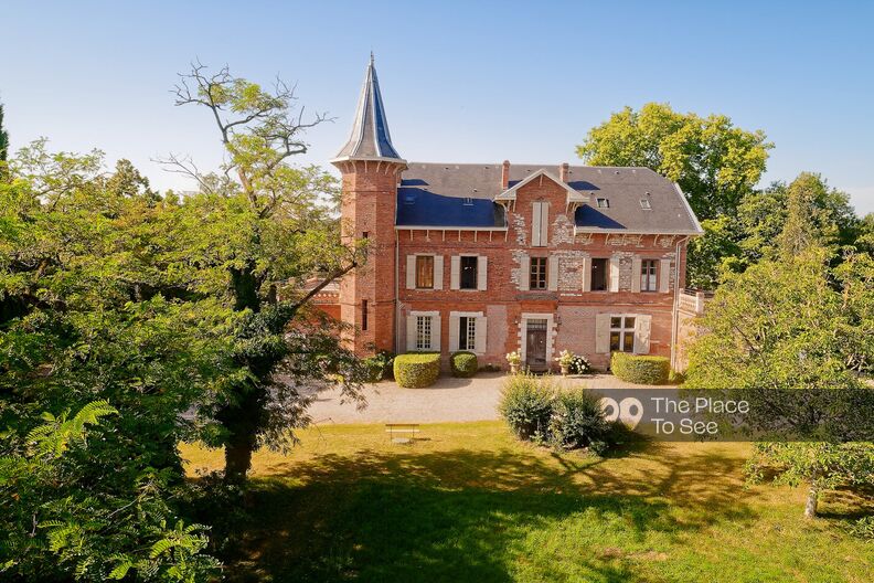 Late 19th century manor house and its renovated old dovecote