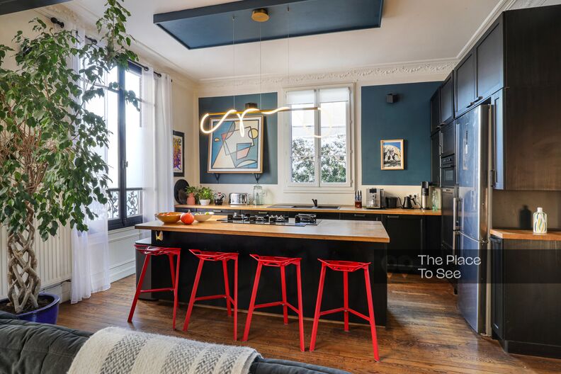 Warm, colorful brick family home furnished with vintage pieces