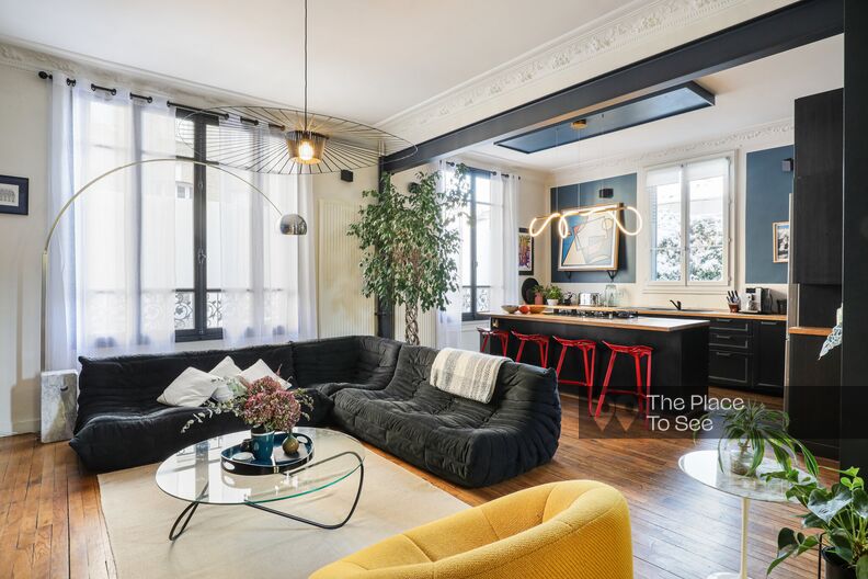 Warm, colorful brick family home furnished with vintage pieces