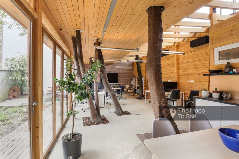 Contemporary office space featuring wood elements and exposed brick walls